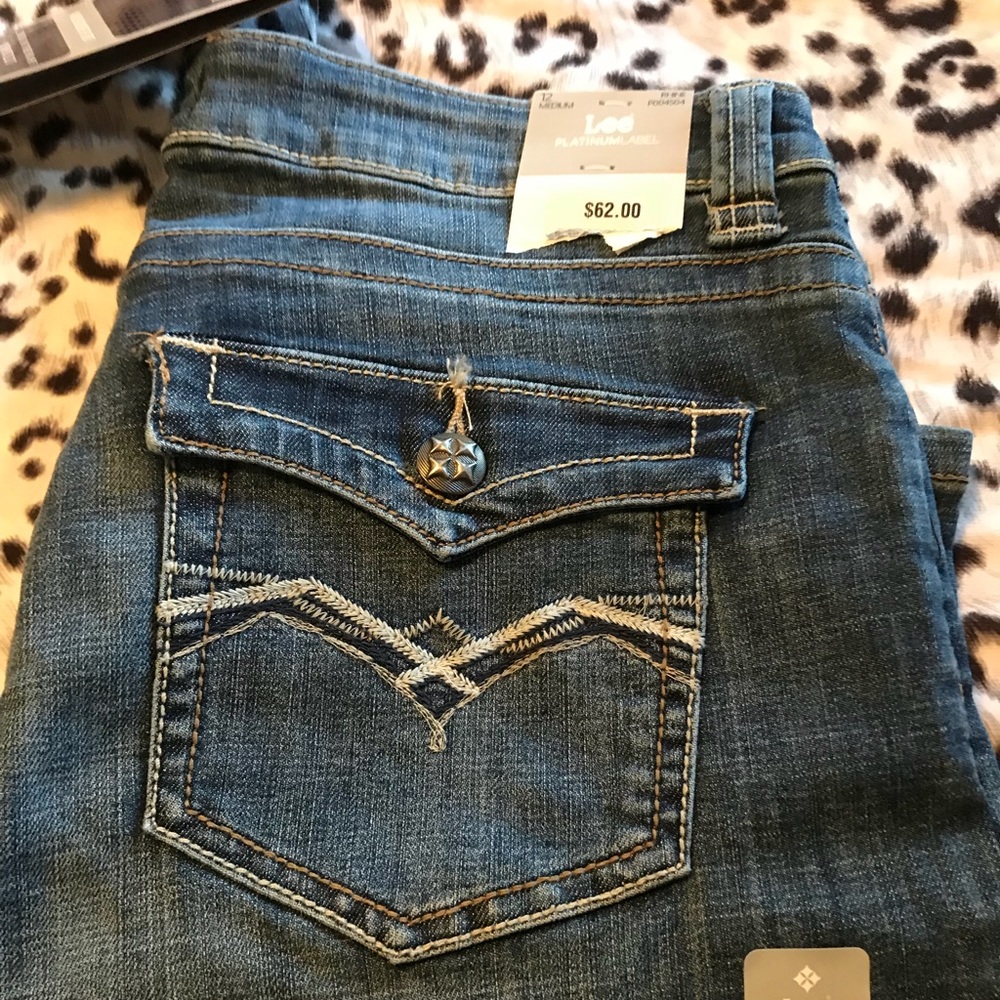 Tags still attached. Lee platinum size 12